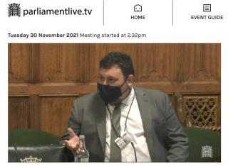 Tom speaking at parliament.